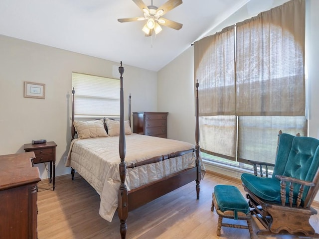 8820 44th Ave, Sebastian, FL 32958 - bedroom with vaulted ceiling, light wood-style floors, multiple windows, and a ceiling fan