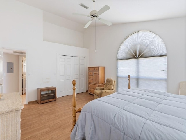 8820 44th Ave, Sebastian, FL 32958 - bedroom with high vaulted ceiling, a closet, light wood-type flooring, and a ceiling fan