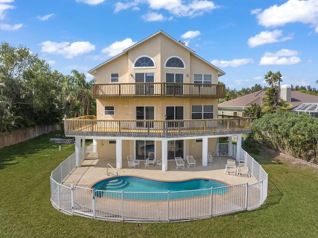 8820 44th Ave, Sebastian, FL 32958 - rear view of property with a fenced backyard, stucco siding, a patio, and a balcony