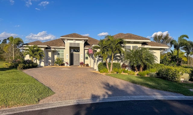 mediterranean / spanish-style home with a front lawn