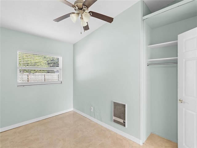 2156 18th St, Vero Beach, FL 32960 - unfurnished bedroom featuring heating unit, a closet, baseboards, and tile patterned flooring