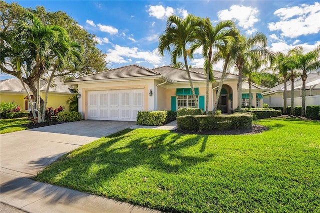 view of front facade with a garage and a front lawn