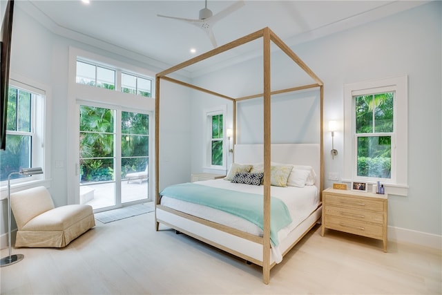 bedroom with light hardwood / wood-style floors, crown molding, ceiling fan, and access to exterior