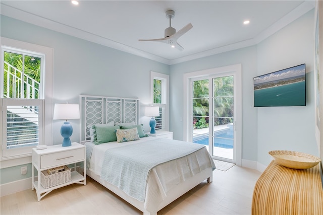 bedroom featuring access to exterior, light wood-type flooring, multiple windows, and ceiling fan