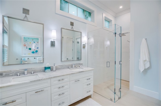 bathroom with plenty of natural light, vanity, and a shower with shower door