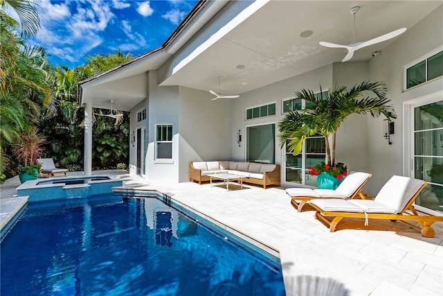 view of swimming pool featuring a patio area, outdoor lounge area, and ceiling fan