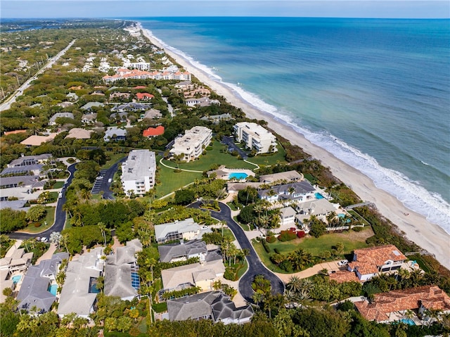 drone / aerial view with a water view and a view of the beach