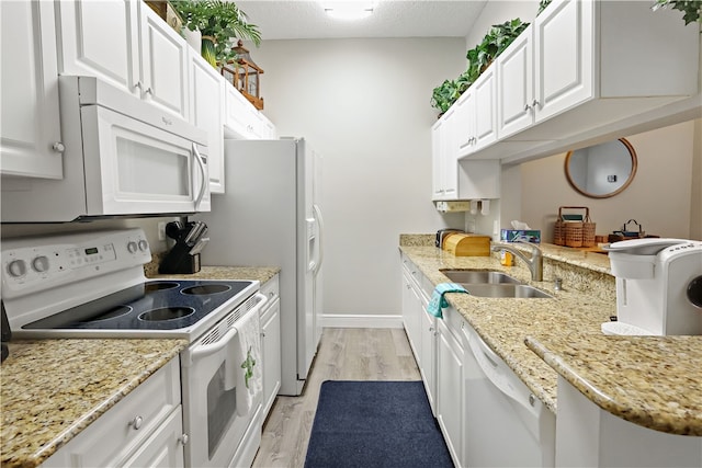 kitchen with a textured ceiling, sink, white cabinetry, light wood-type flooring, and white appliances