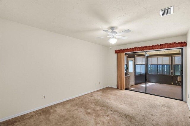 723 Timber Ridge Trl SW Unit B, Vero Beach, FL 32962 - carpeted empty room with a ceiling fan and baseboards