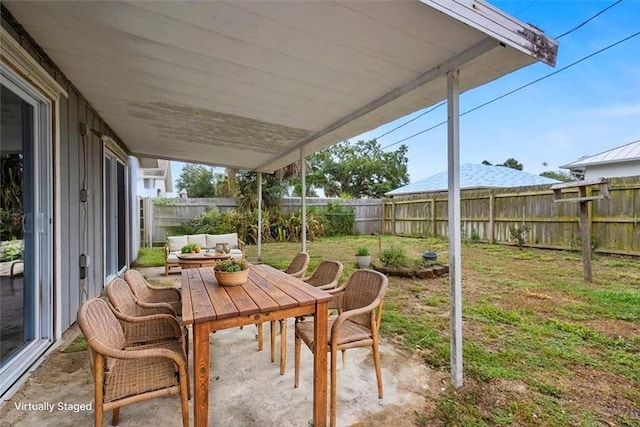233 13th St SW, Vero Beach, FL 32962 - view of patio / terrace with an outdoor living space and outdoor dining area