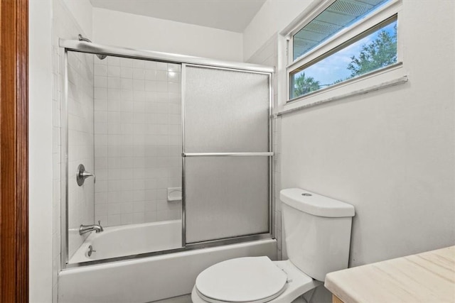233 13th St SW, Vero Beach, FL 32962 - bathroom with toilet, enclosed tub / shower combo, and vanity