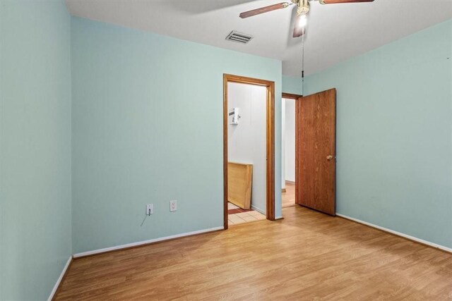 233 13th St SW, Vero Beach, FL 32962 - unfurnished bedroom with light wood-style floors, baseboards, and a ceiling fan