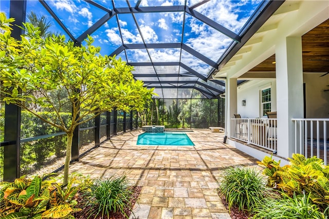 view of pool with a patio and a lanai