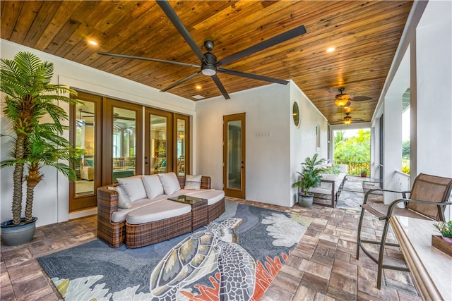 view of patio featuring ceiling fan, french doors, and an outdoor living space