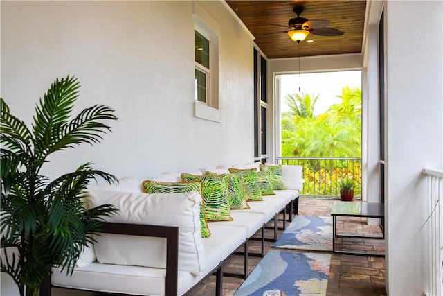 balcony with a porch and ceiling fan