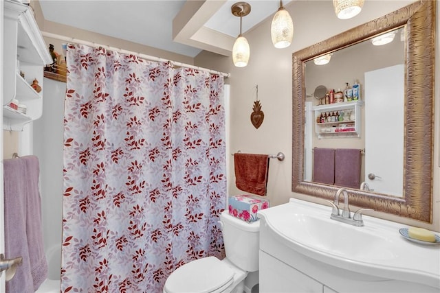 bathroom featuring toilet, a shower with curtain, and vanity