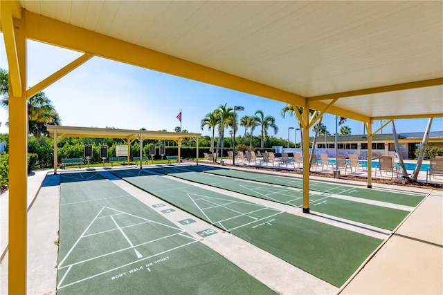 view of home's community featuring shuffleboard and a pool