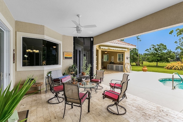 view of patio featuring ceiling fan