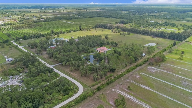 aerial view with a rural view and a water view