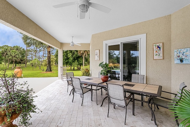 view of patio / terrace featuring ceiling fan