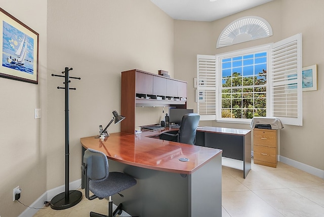 tiled office space with a high ceiling