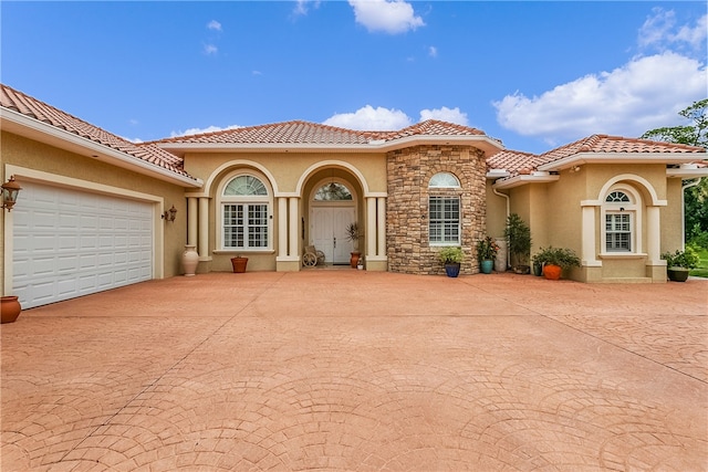 view of front of property with a garage