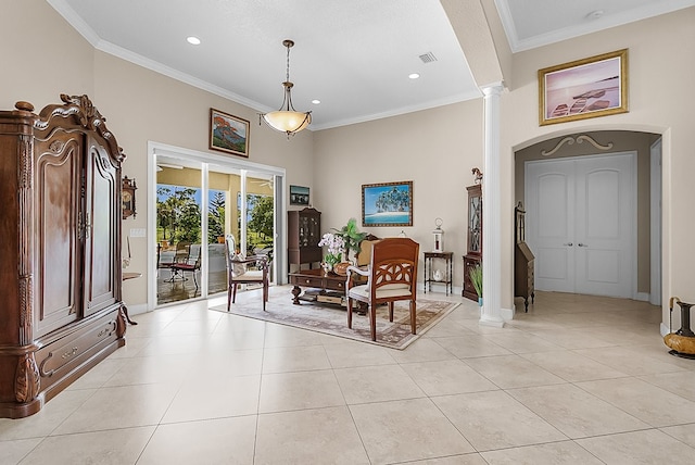 dining space with ornamental molding, light tile patterned flooring, a high ceiling, and decorative columns