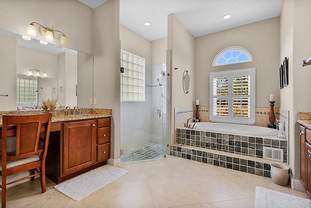 bathroom with vanity, tile patterned floors, and separate shower and tub