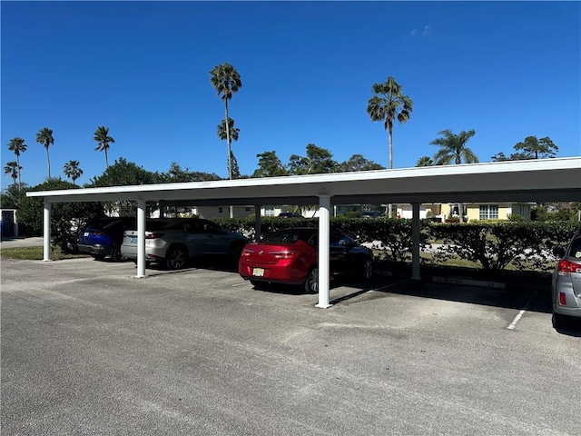 view of vehicle parking with a carport