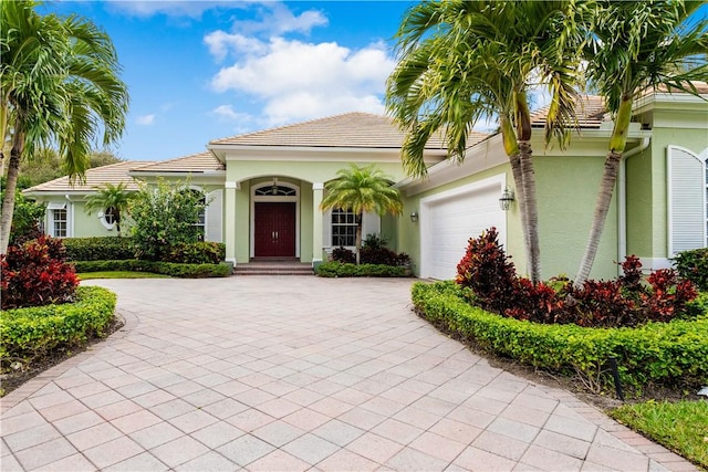 mediterranean / spanish-style house featuring a garage