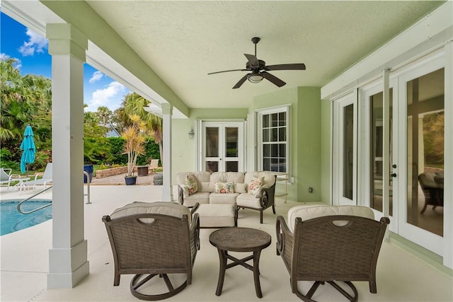 view of patio featuring outdoor lounge area, ceiling fan, and french doors