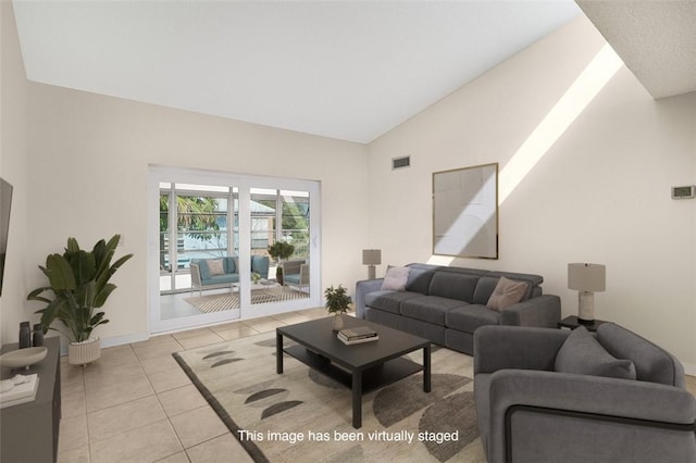 living room with visible vents, vaulted ceiling, baseboards, and light tile patterned floors