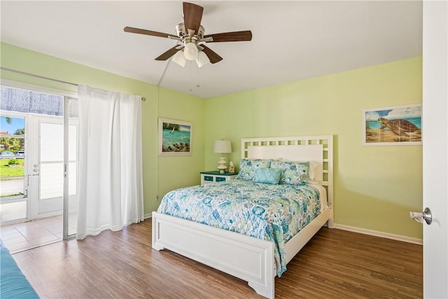 bedroom featuring hardwood / wood-style floors, ceiling fan, and access to exterior