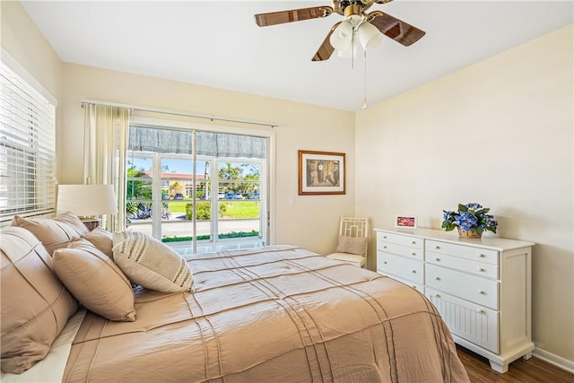 bedroom featuring hardwood / wood-style flooring, ceiling fan, and access to outside