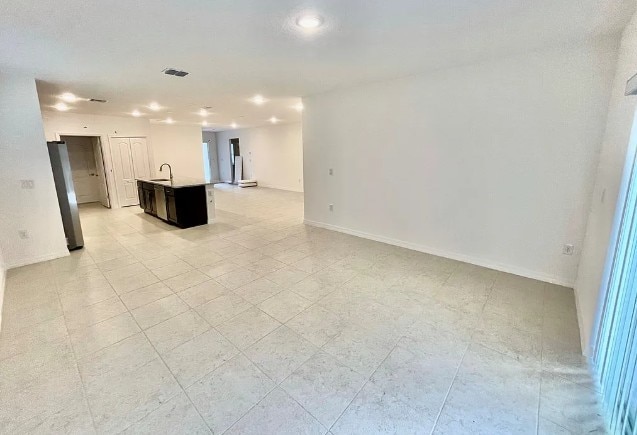 450 Hazel St, Sebastian, FL 32958 - empty room with baseboards and recessed lighting