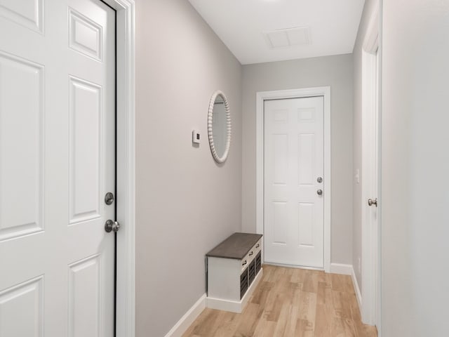 doorway to outside with light wood-type flooring