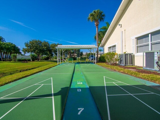 482 Grove Isle Cir Unit 482, Vero Beach, FL 32962 - view of property's community with shuffleboard and a yard