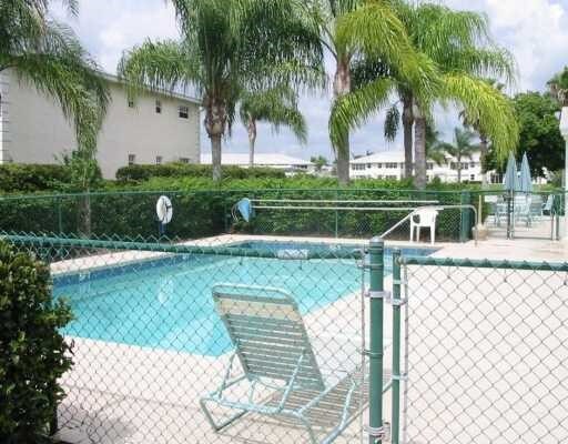 482 Grove Isle Cir Unit 482, Vero Beach, FL 32962 - view of swimming pool featuring a gate