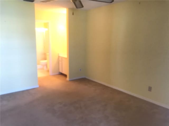 carpeted empty room with ceiling fan