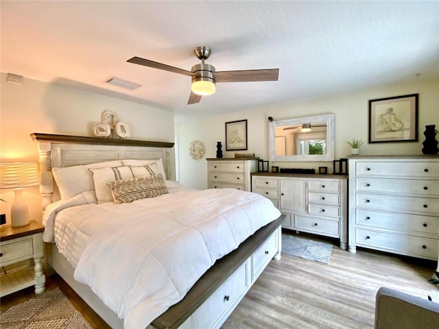 bedroom with ceiling fan and light wood-type flooring