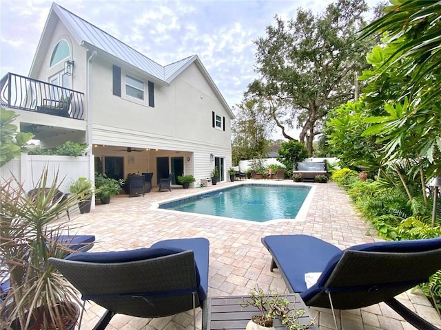 view of pool featuring a hot tub and a patio