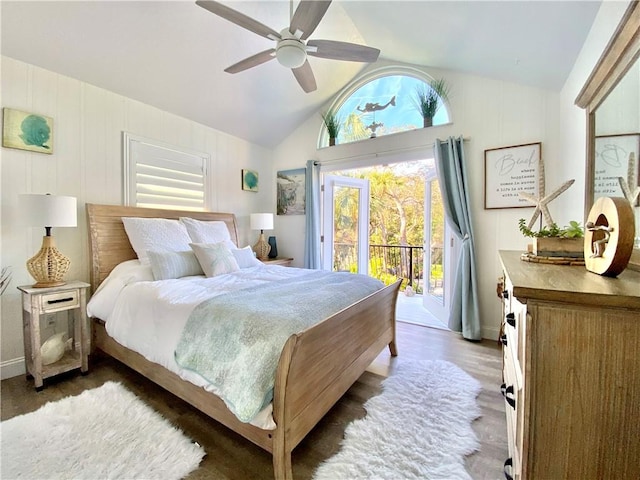 bedroom featuring ceiling fan, lofted ceiling, access to exterior, and dark hardwood / wood-style flooring