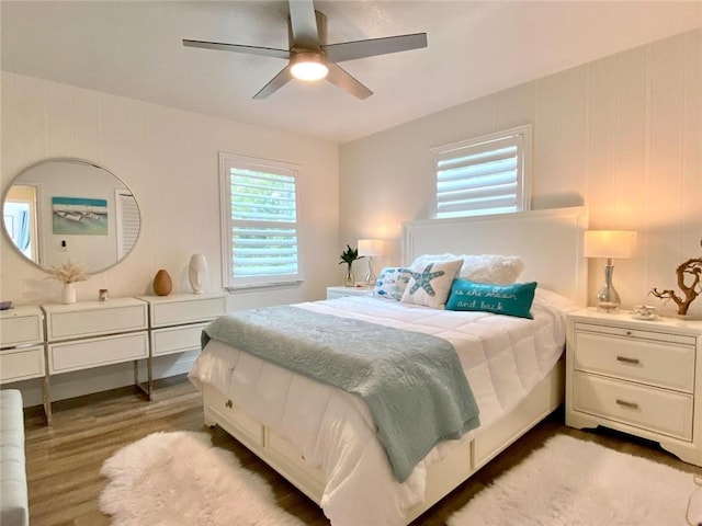 bedroom featuring wood-type flooring and ceiling fan