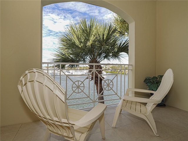 balcony featuring a water view