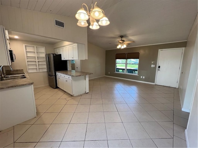 kitchen featuring visible vents, ceiling fan with notable chandelier, open floor plan, a sink, and appliances with stainless steel finishes