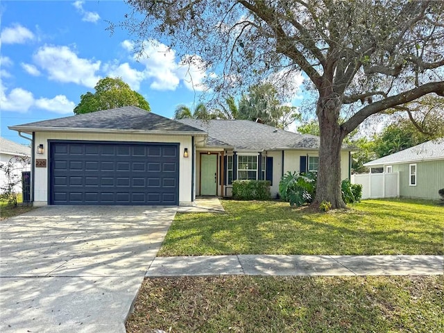 ranch-style house with a garage and a front yard