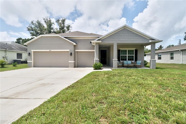 view of front of house with a garage, a porch, a front yard, and central air condition unit