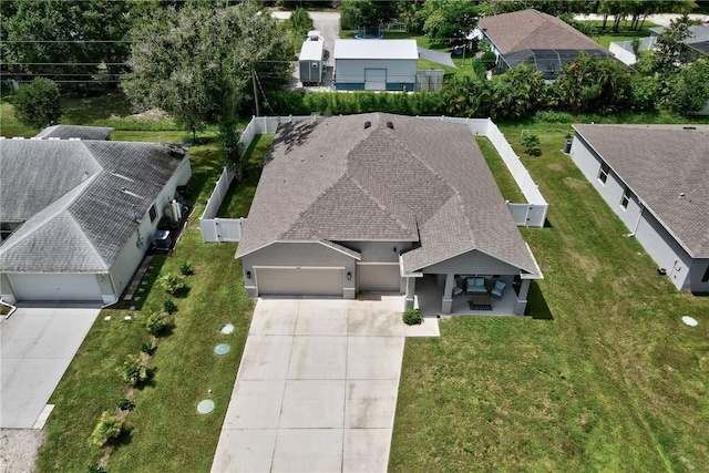 view of front facade with an outdoor living space, a garage, and a lawn