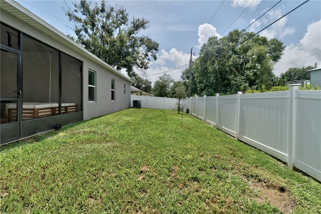 view of yard featuring central AC unit