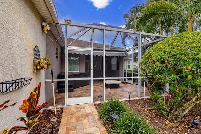 view of patio with a lanai